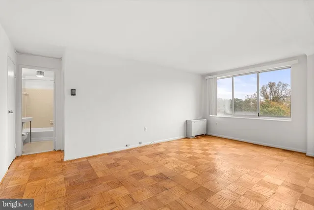 a view of an empty room with a window