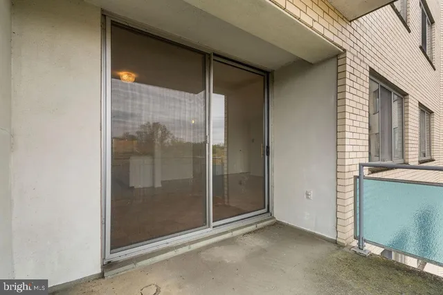 a view of a bathroom with a glass door and shower