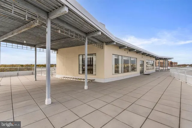 a patio with table and chairs