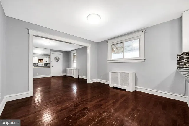 a kitchen with granite countertop a sink cabinets and stainless steel appliances
