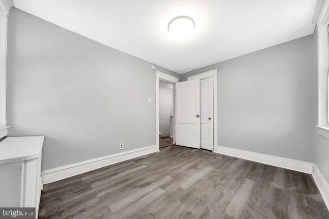 a view of an empty room with stairs