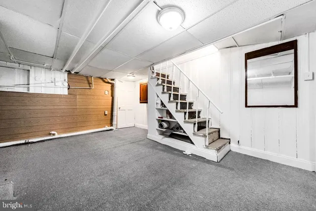 a view of a storage & utility room with a washer dryer