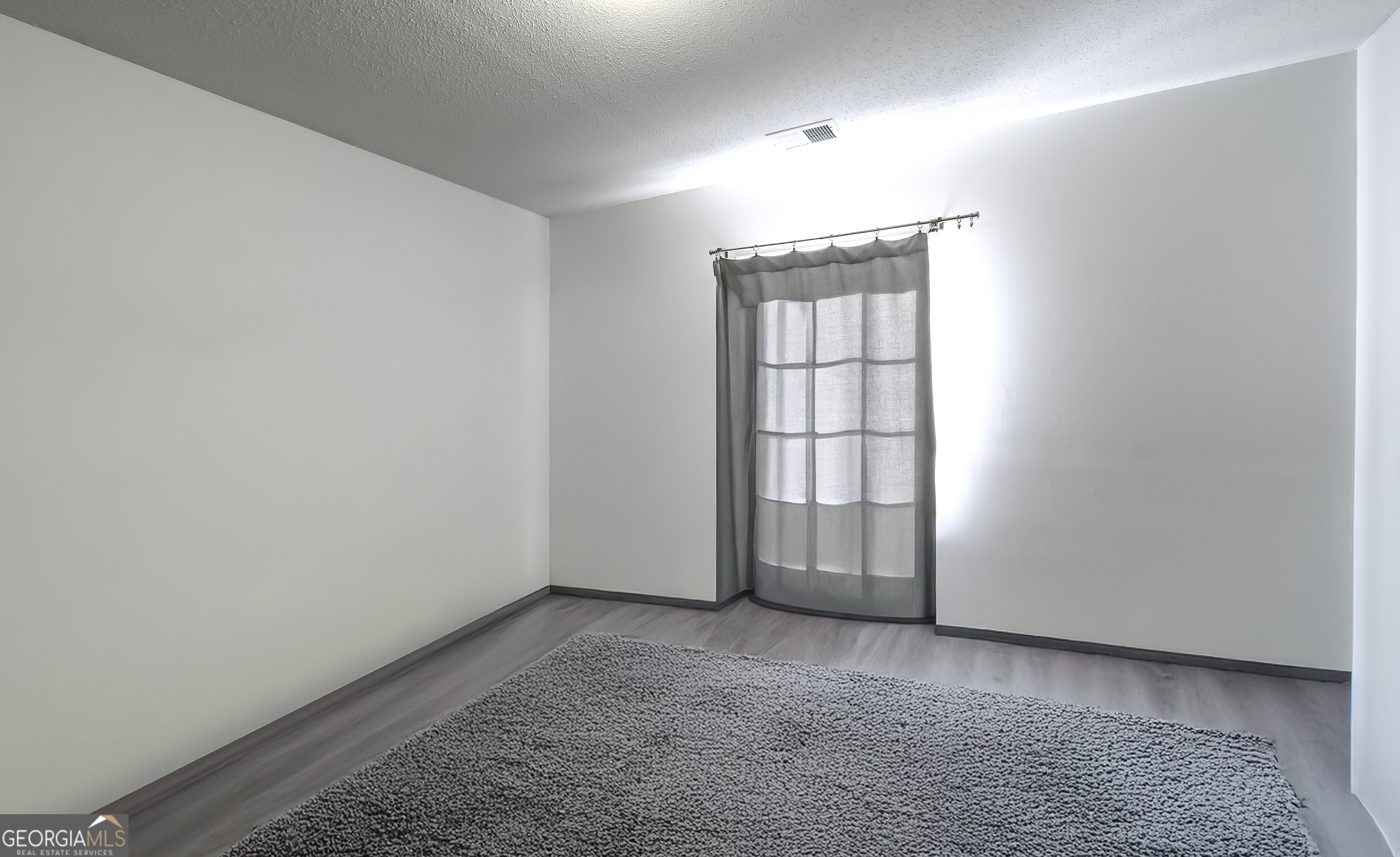 116 Kyle Way Carrollton, GA 30117 - Photo 12 of 30 an empty room with windows