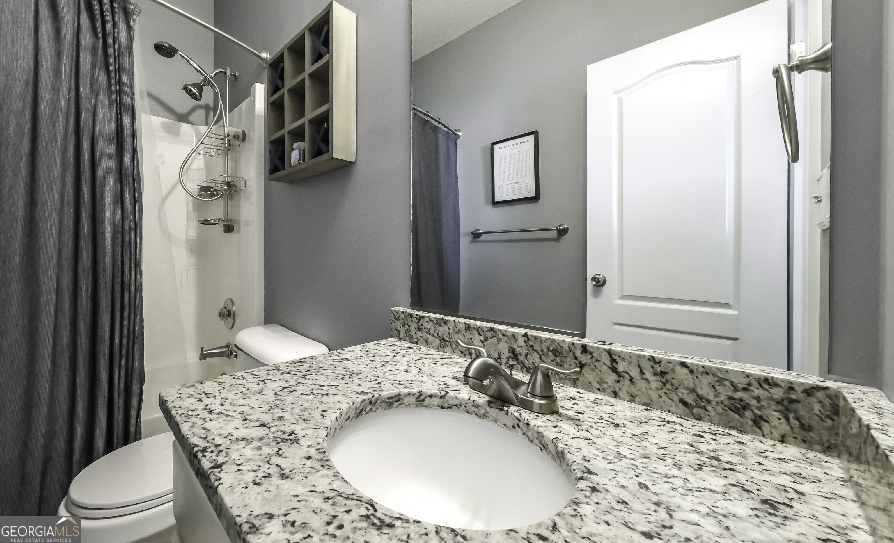 116 Kyle Way Carrollton, GA 30117 - Photo 13 of 30 a bathroom with a granite countertop sink and a mirror
