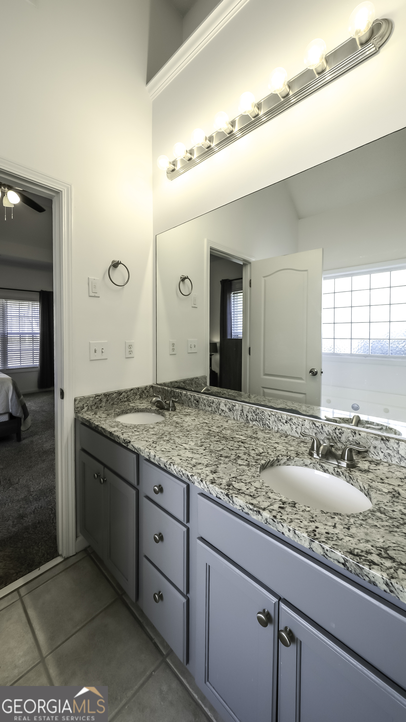 116 Kyle Way Carrollton, GA 30117 - Photo 19 of 30 a bathroom with a granite countertop sink and a mirror