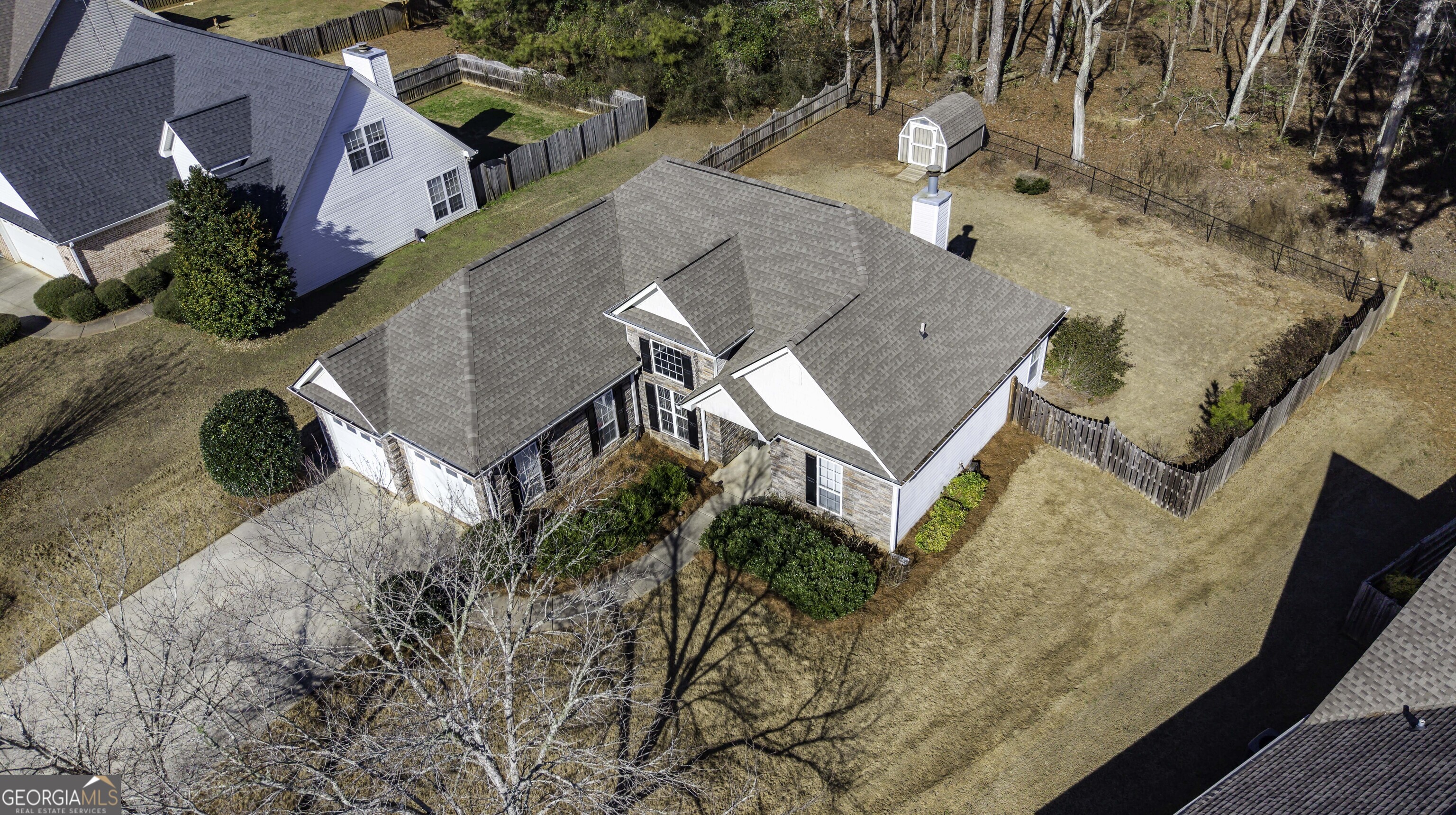 116 Kyle Way Carrollton, GA 30117 - Photo 2 of 30 an aerial view of a house with a yard and wooden fence