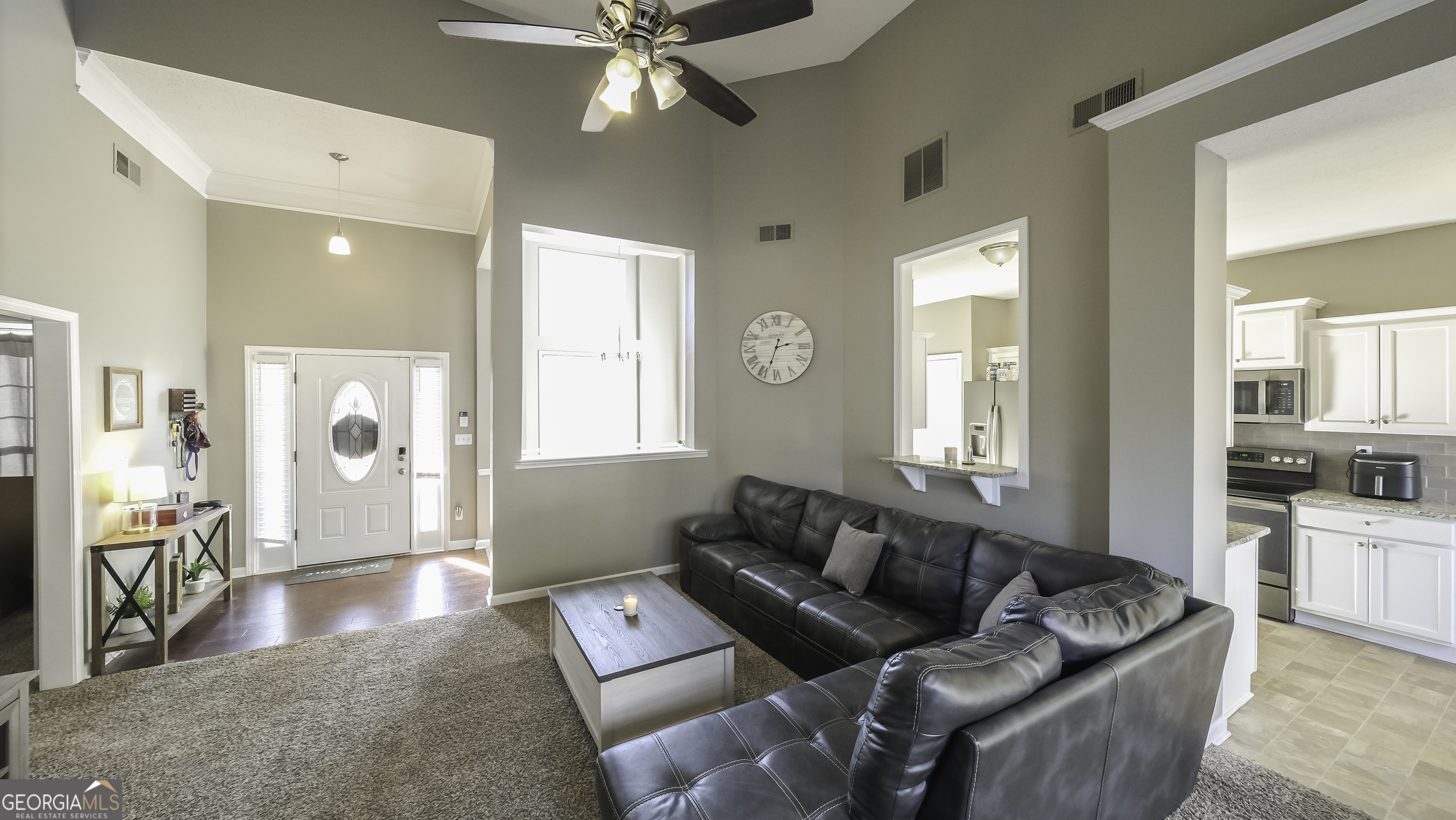 116 Kyle Way Carrollton, GA 30117 - Photo 7 of 30 a living room with furniture and a large window