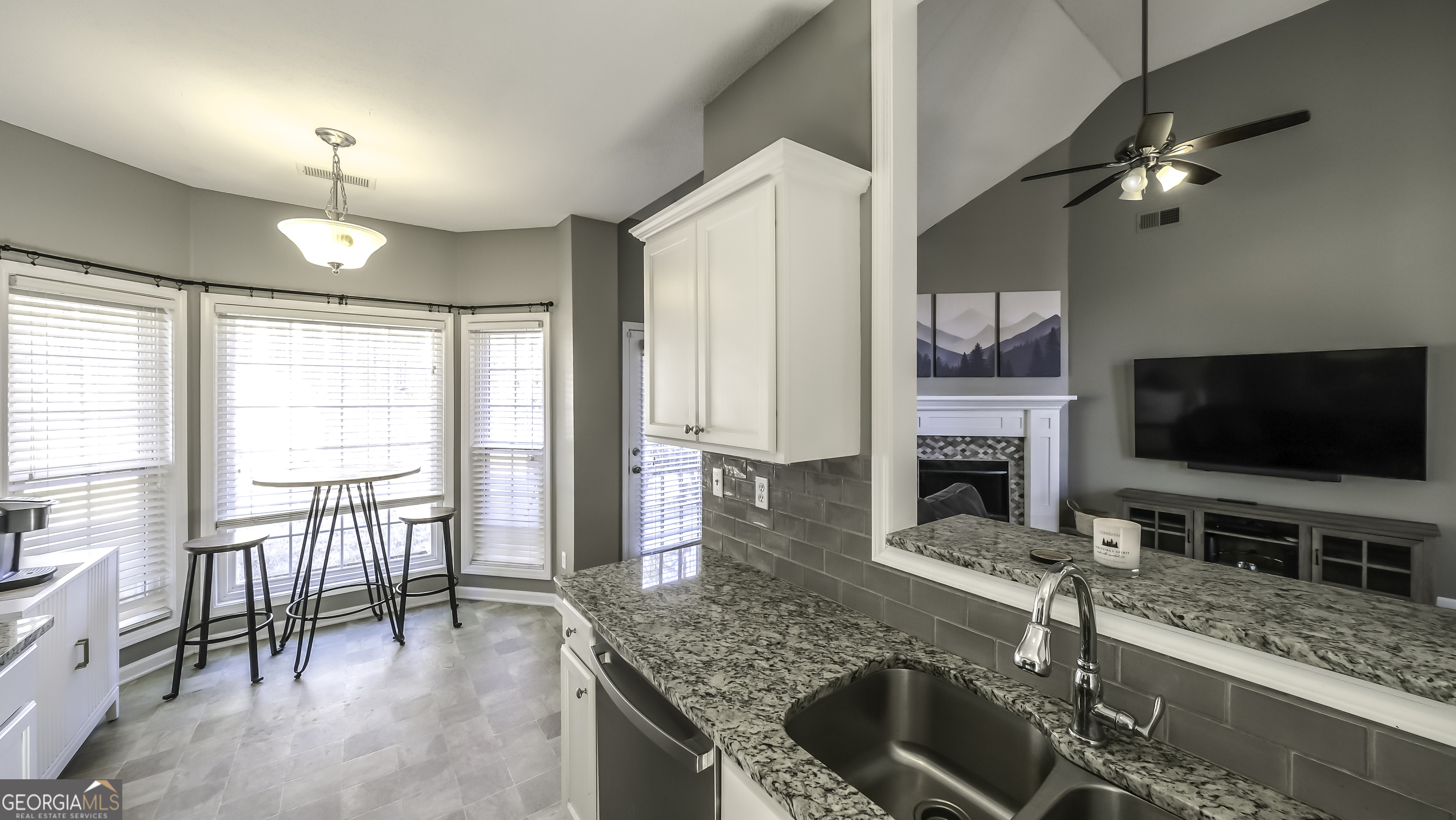 116 Kyle Way Carrollton, GA 30117 - Photo 9 of 30 a kitchen with a stove a sink and a microwave