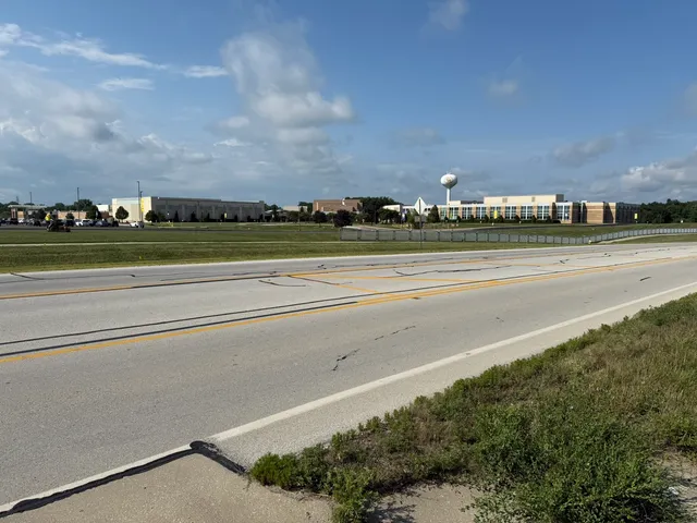 a view of a lake with houses in the back