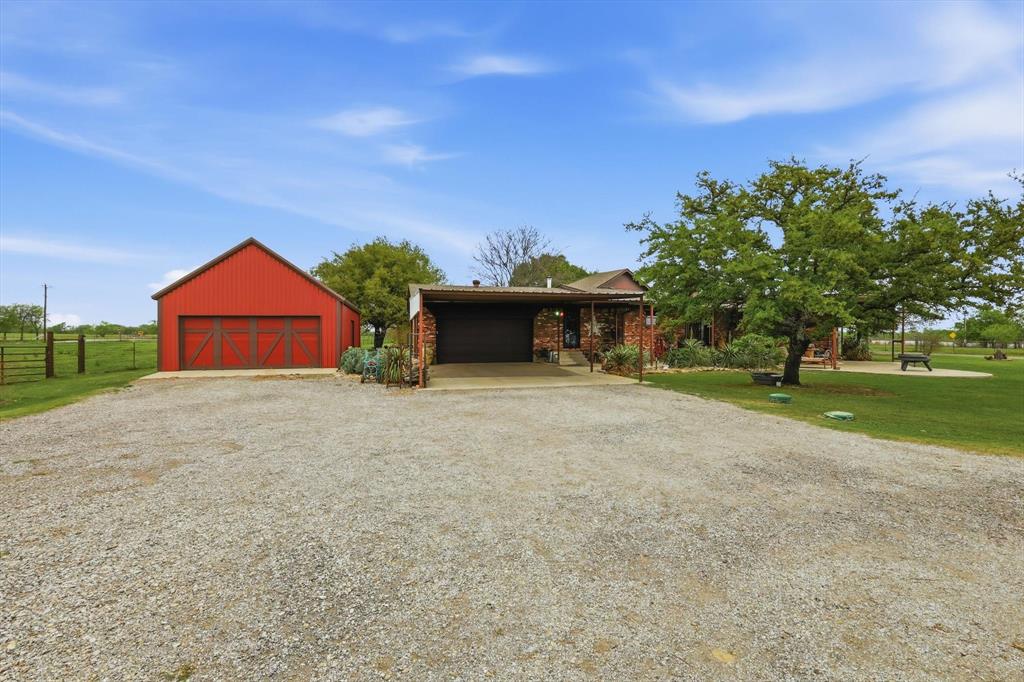 10965 Swafford Road Justin, TX 76247 - Photo 5 of 26 Back of home with rear garage entrance