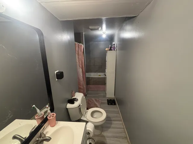 a room with a bed and a large mirror