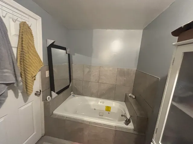 a view of a hallway with living room and furniture