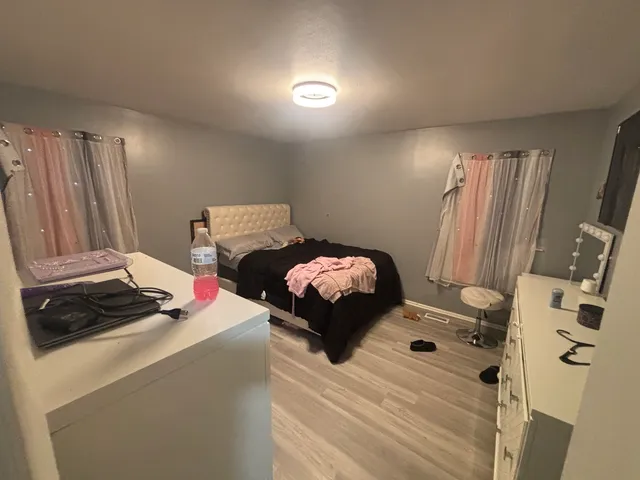 a bedroom with a bed and a mirror