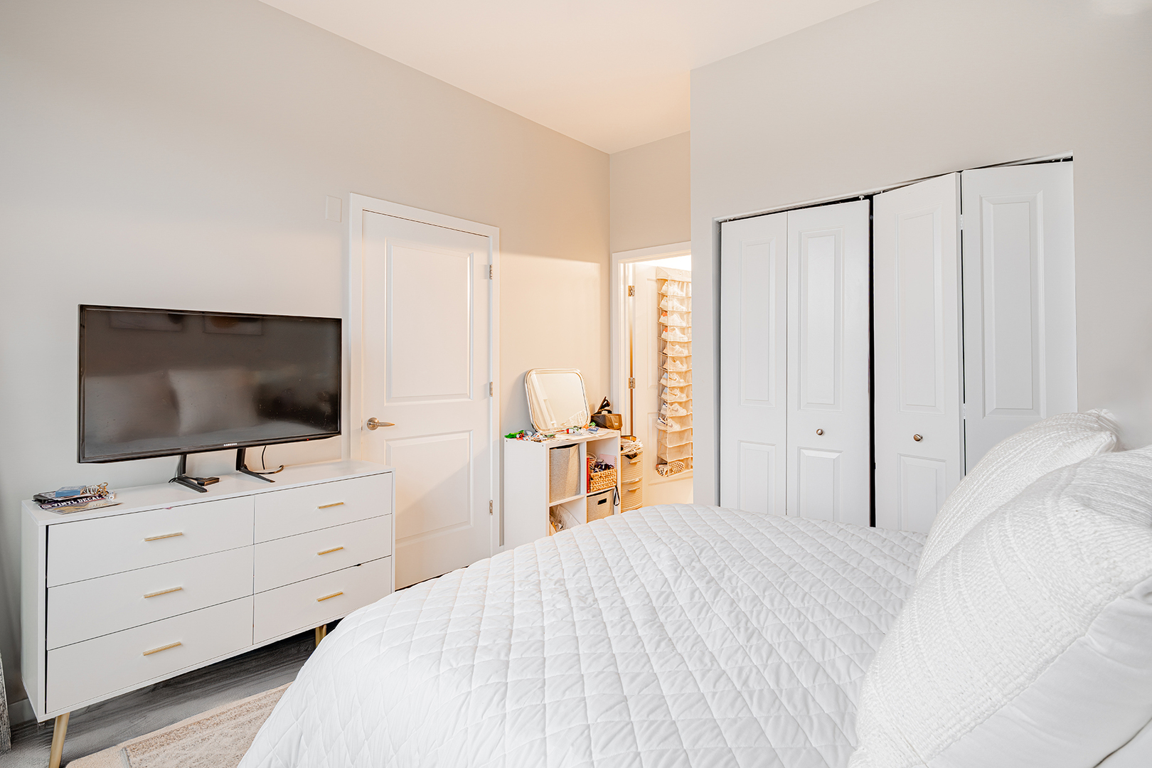 1228 West Monroe Street, Unit 504 Chicago, IL 60607 - Photo 14 of 23 a bedroom with a bed and a flat screen tv