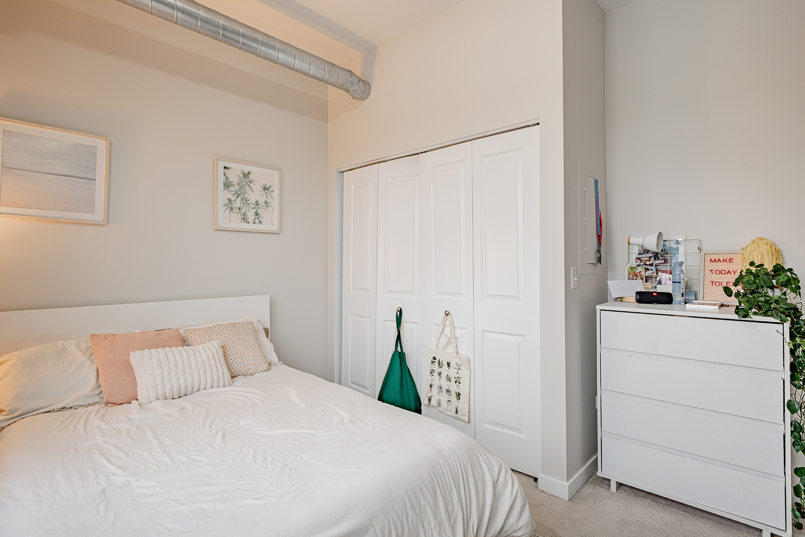 1228 West Monroe Street, Unit 504 Chicago, IL 60607 - Photo 19 of 23 a bedroom with a bed and cabinets