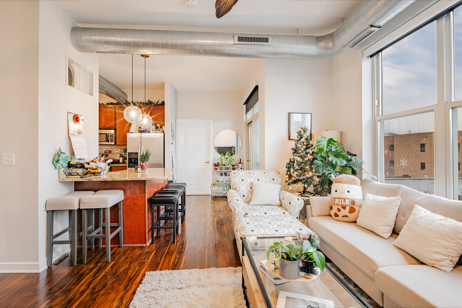 1228 West Monroe Street, Unit 504 Chicago, IL 60607 - Photo 4 of 23 a living room with furniture kitchen view and a large window