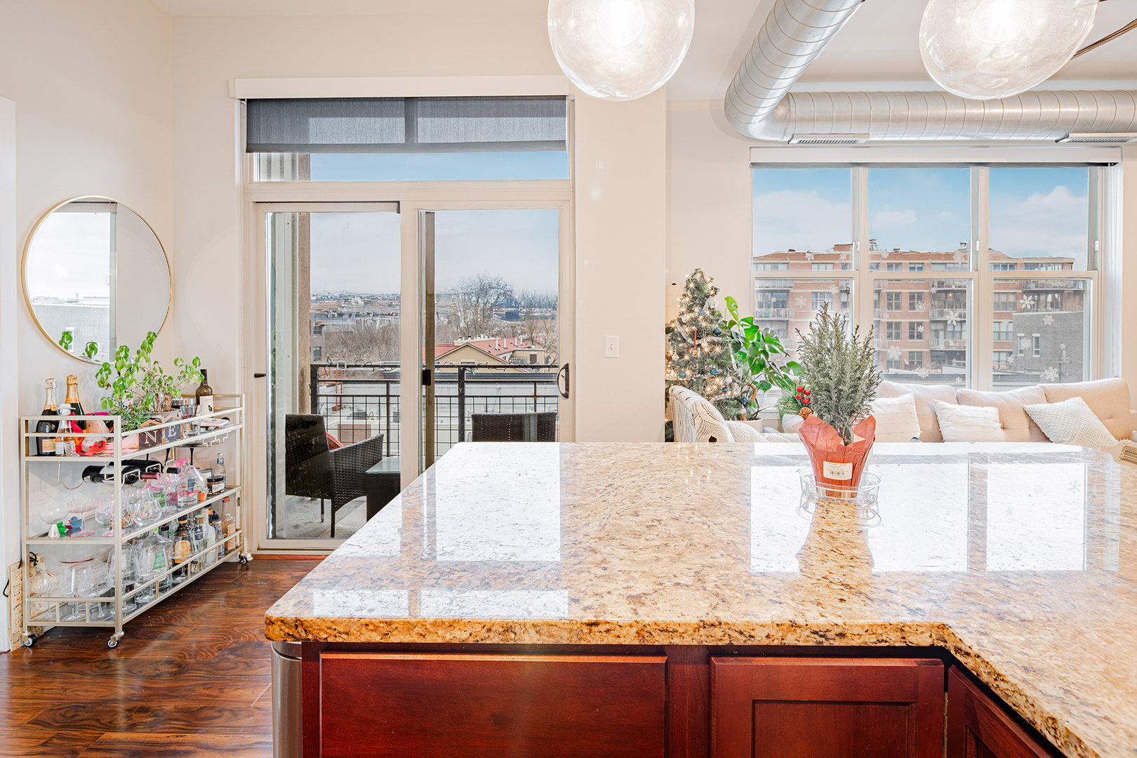 1228 West Monroe Street, Unit 504 Chicago, IL 60607 - Photo 8 of 23 a large white kitchen with a granite counter top