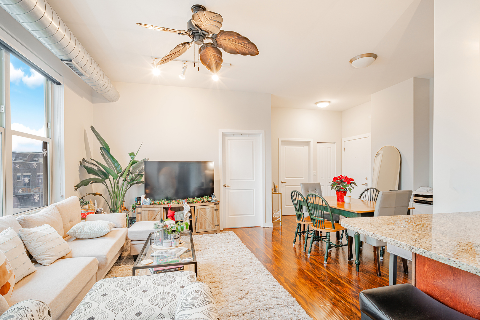 1228 West Monroe Street, Unit 504 Chicago, IL 60607 - Photo 10 of 23 a living room with furniture and a flat screen tv