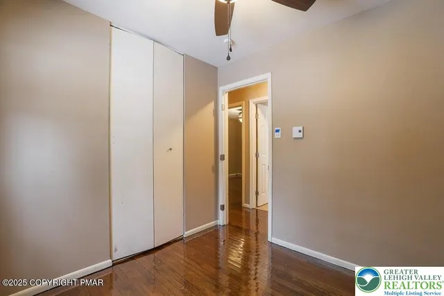 a view of an entryway with wooden floor