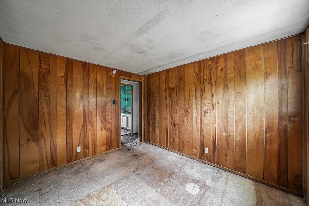 5552 Nelson Mosier Road Southington, OH 44470 - Photo 4 of 24 Bedroom with wooden walls