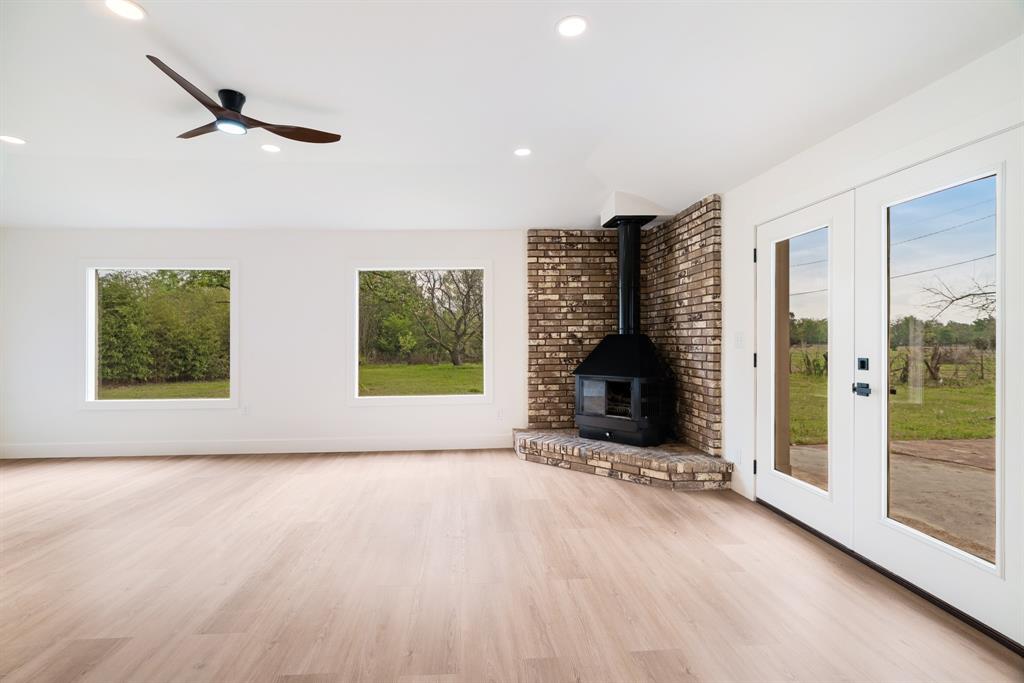 175 Cozy Lane Paris, TX 75462 - Photo 16 of 21 a view of an empty room with glass door and windows