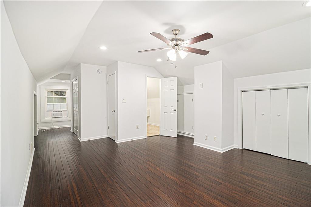 1719 Flat Shoals Road Southeast Atlanta, GA 30316 - Photo 21 of 28 a view of an empty room with wooden floor