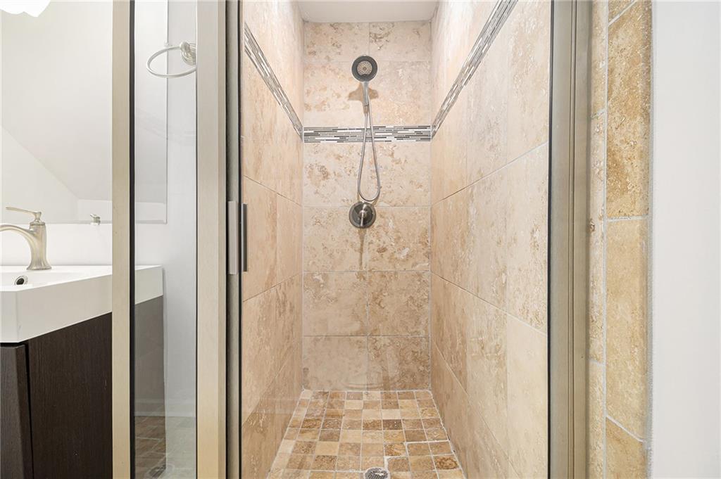 1719 Flat Shoals Road Southeast Atlanta, GA 30316 - Photo 24 of 28 a bathroom with a shower