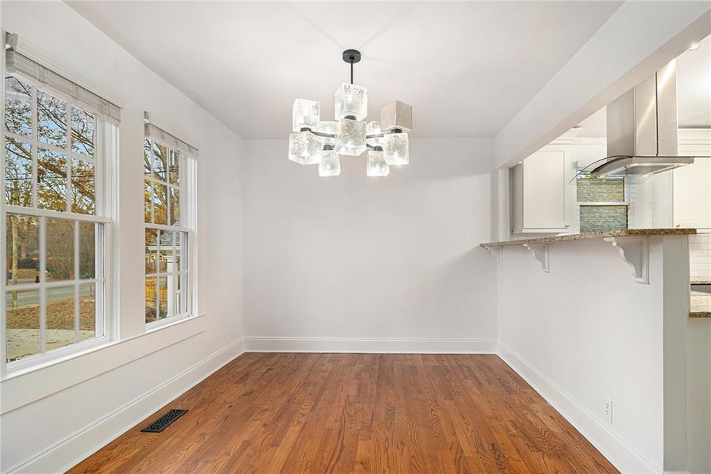 1719 Flat Shoals Road Southeast Atlanta, GA 30316 - Photo 9 of 28 a view of empty room with wooden floor and window