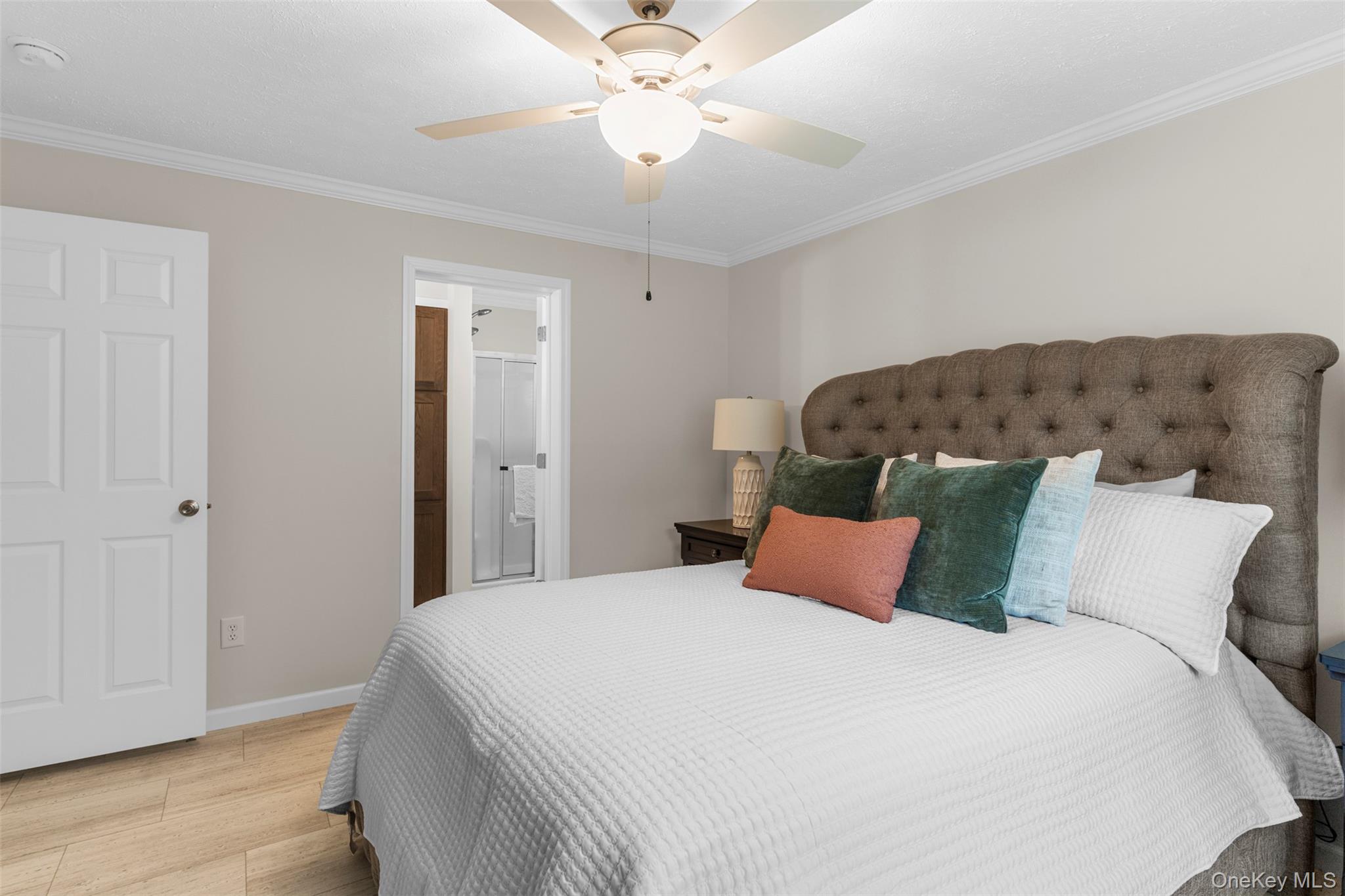 242 Ruby Road, Unit 18 Kingston, NY 12401 - Photo 15 of 23 a bedroom with a bed and a ceiling fan