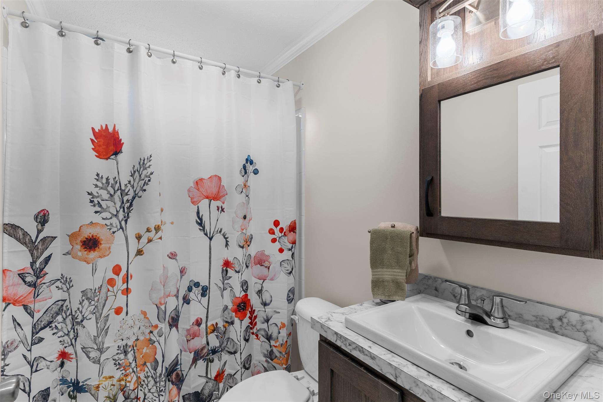 242 Ruby Road, Unit 18 Kingston, NY 12401 - Photo 17 of 23 a bathroom with a sink toilet and a mirror