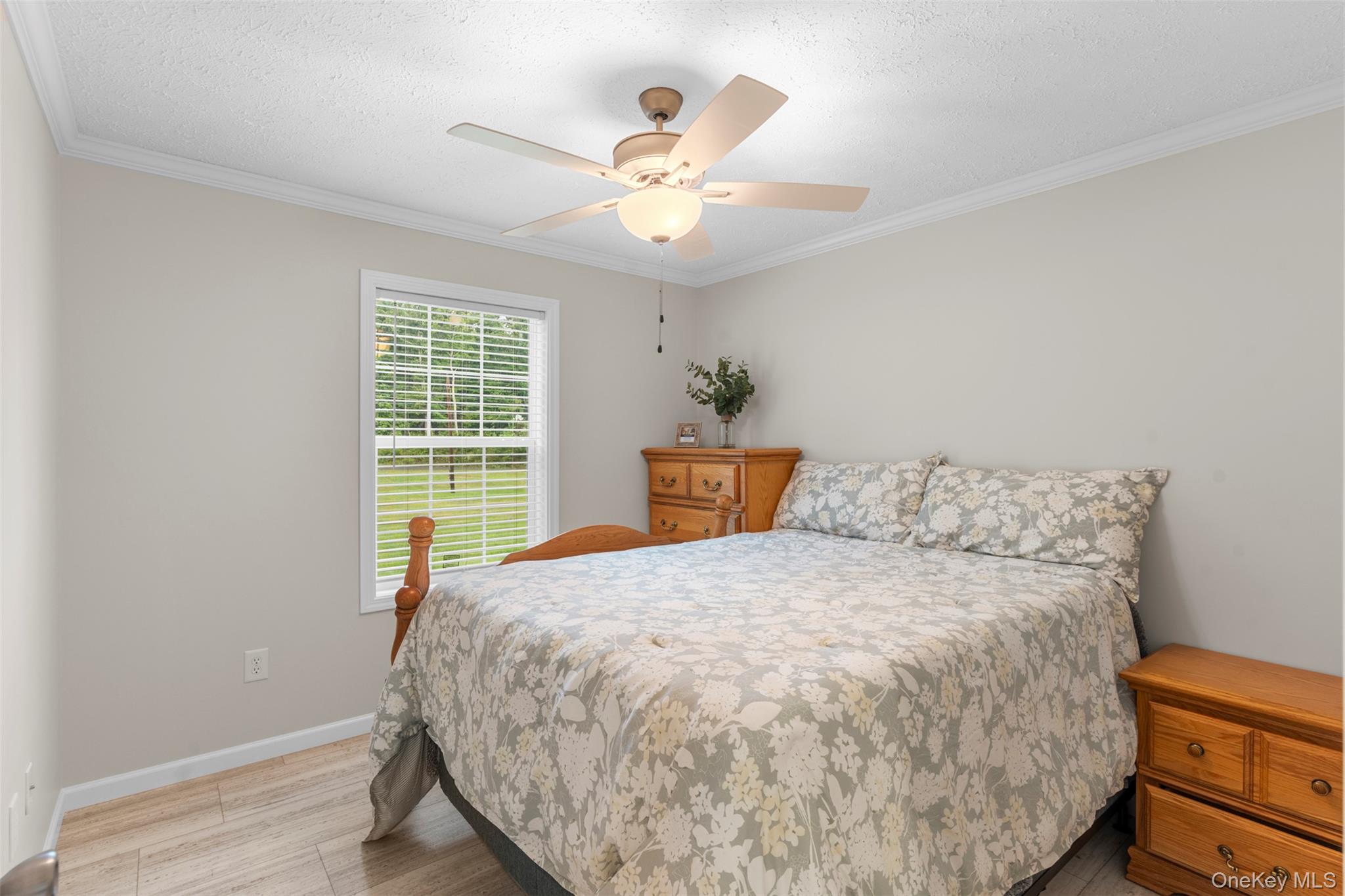 242 Ruby Road, Unit 18 Kingston, NY 12401 - Photo 18 of 23 a bed sitting in a spacious bedroom next to a window