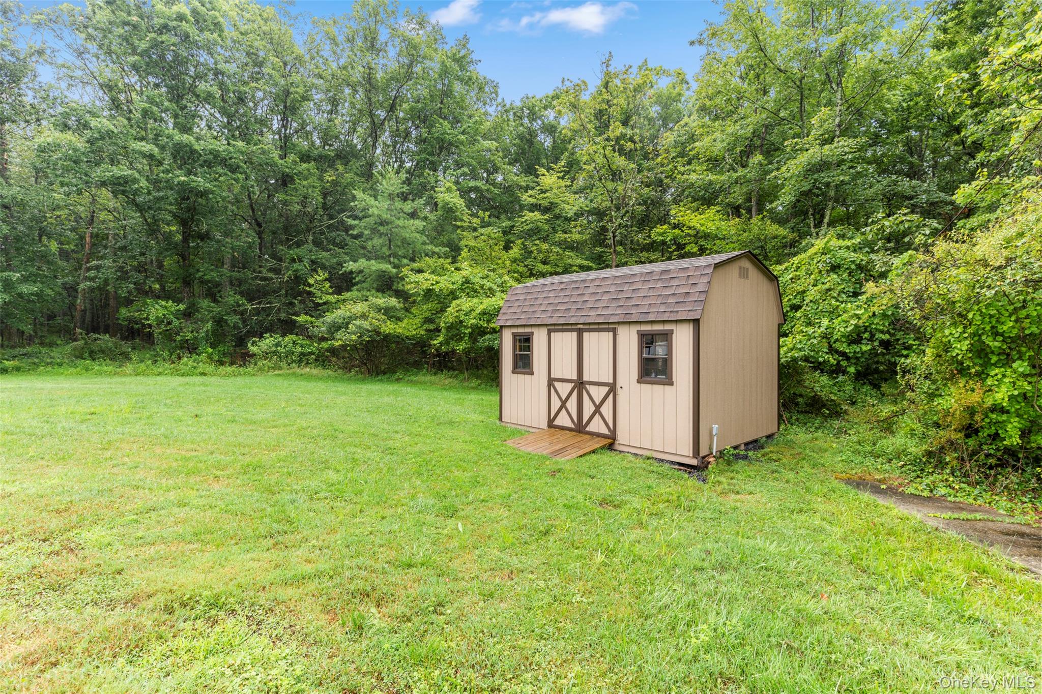 242 Ruby Road, Unit 18 Kingston, NY 12401 - Photo 20 of 23 a view of a house with backyard