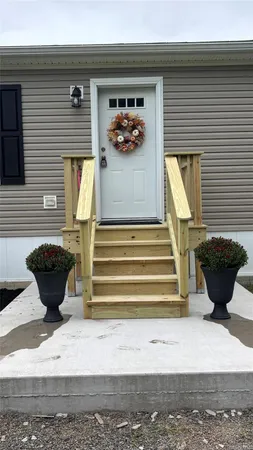 a view of a house with a lounge chair