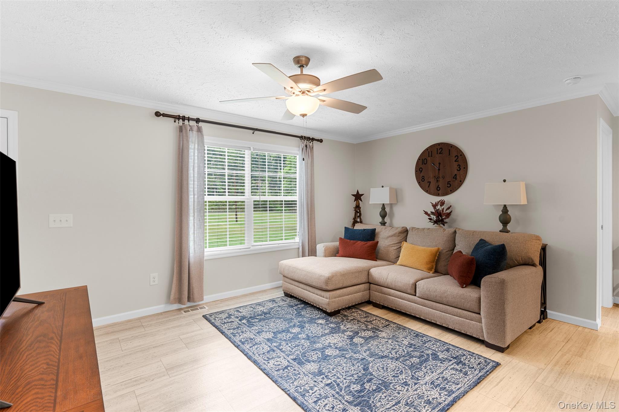 242 Ruby Road, Unit 18 Kingston, NY 12401 - Photo 5 of 23 a living room with furniture and a large window