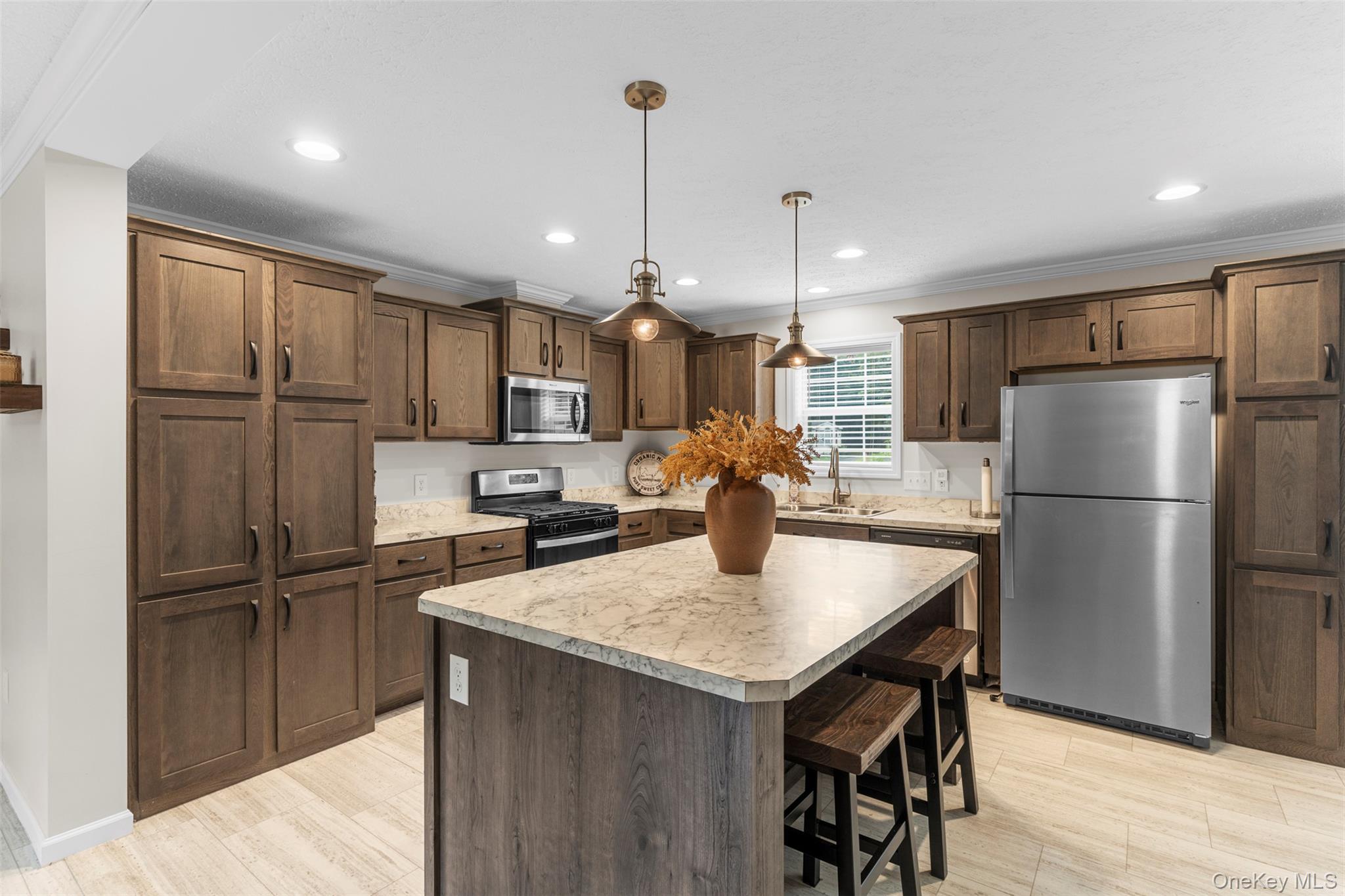 242 Ruby Road, Unit 18 Kingston, NY 12401 - Photo 8 of 23 a kitchen with refrigerator a sink and a wooden cabinets