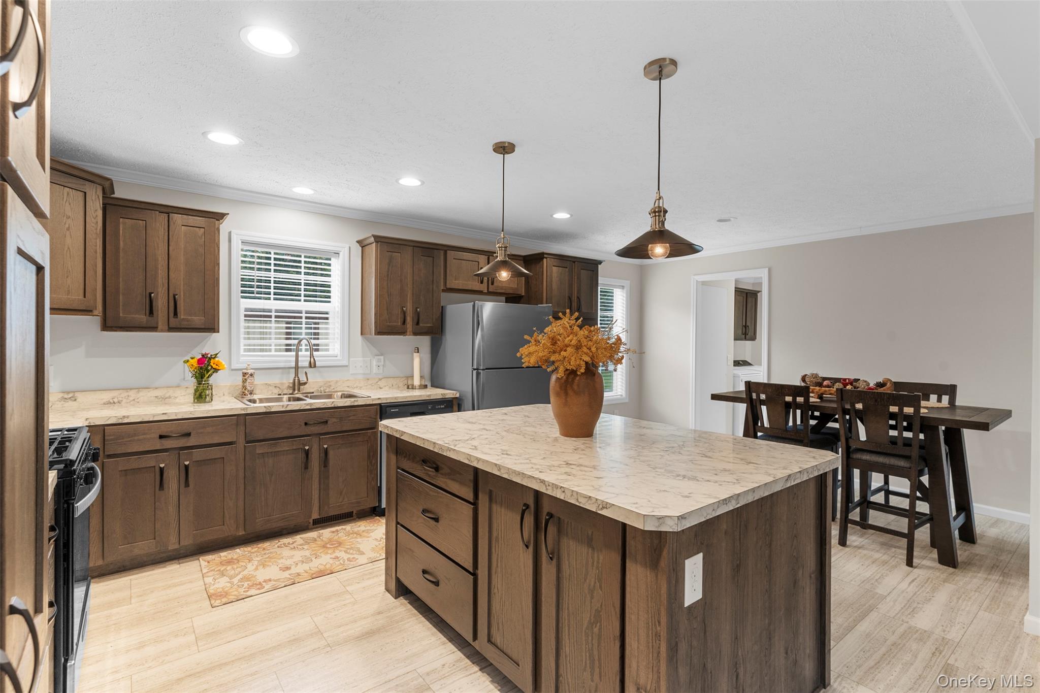 242 Ruby Road, Unit 18 Kingston, NY 12401 - Photo 9 of 23 a kitchen with granite countertop a sink a counter space appliances and cabinets