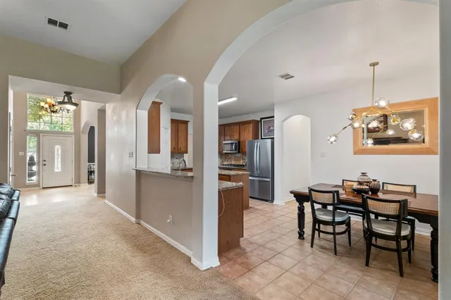 a view of a dining room with furniture