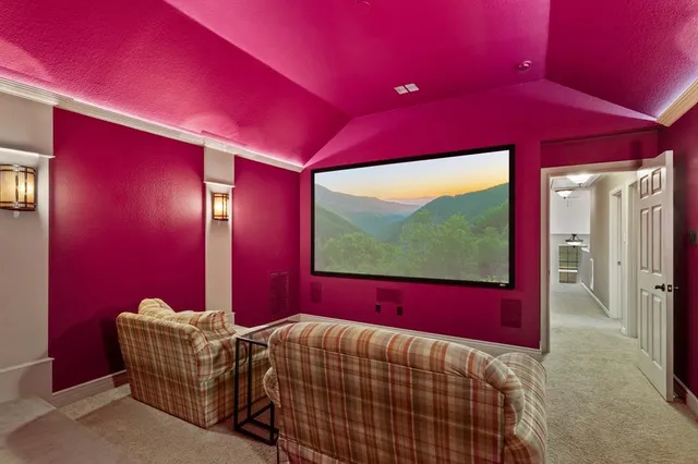 a bed room with a bed and a flat screen tv