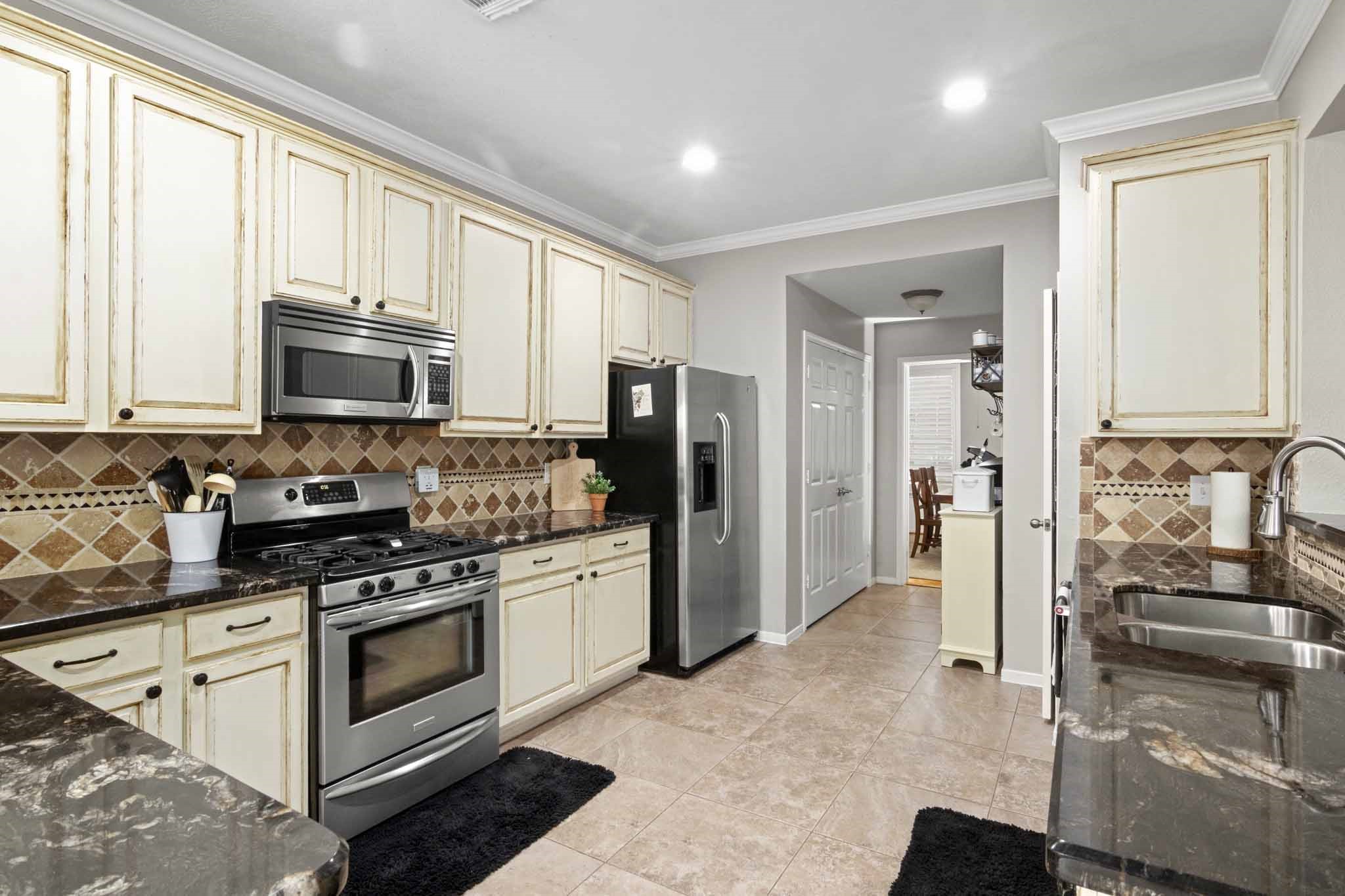 4311 Green Tree Court Pasadena, TX 77505 - Photo 17 of 49 Upgraded kitchen with great cabinet and counter space.