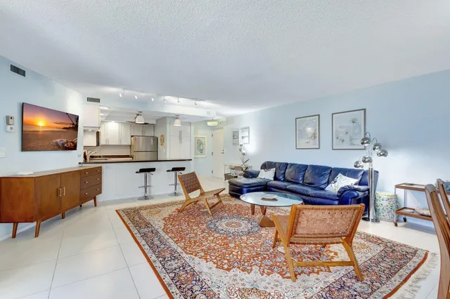 a bedroom with a large bed and a dresser