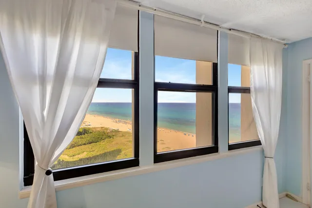 a bathroom with a sink vanity granite tub and shower