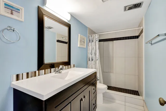 a kitchen with stainless steel appliances granite countertop a stove and a refrigerator