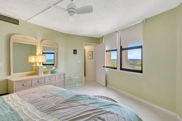a bathroom with a sink toilet and a mirror