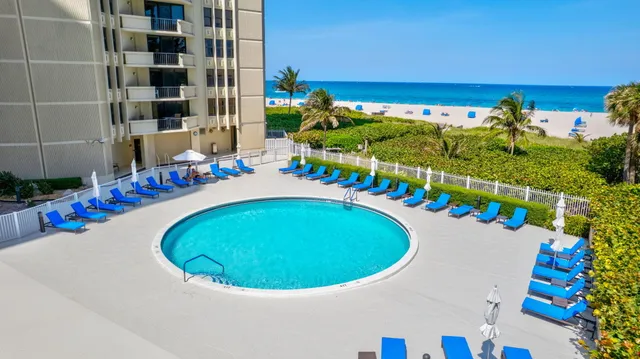 an aerial view of a swimming pool and outdoor space