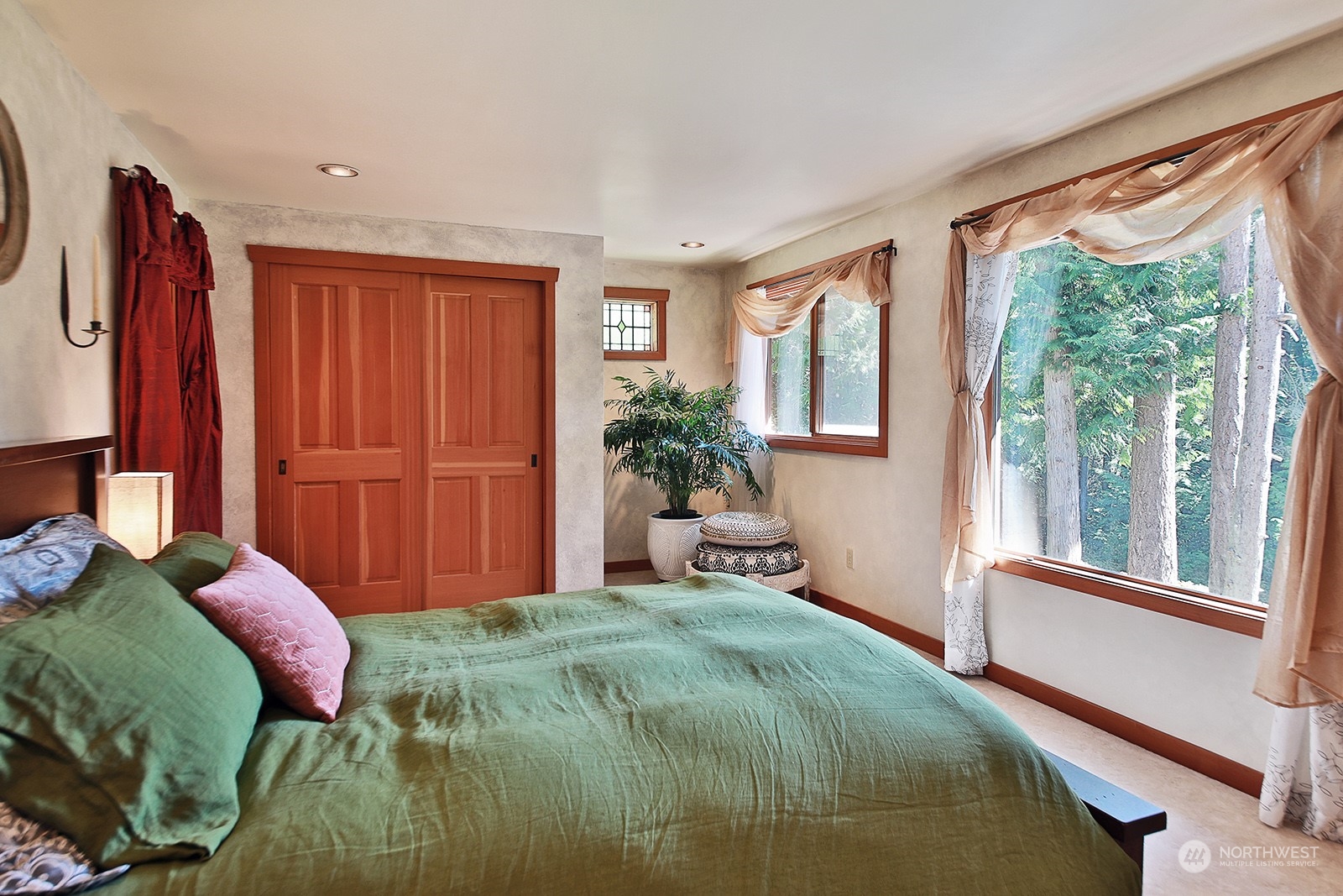 5120 Ribbit Road Langley, WA 98260 - Photo 21 of 40 a bedroom with a bed and a window