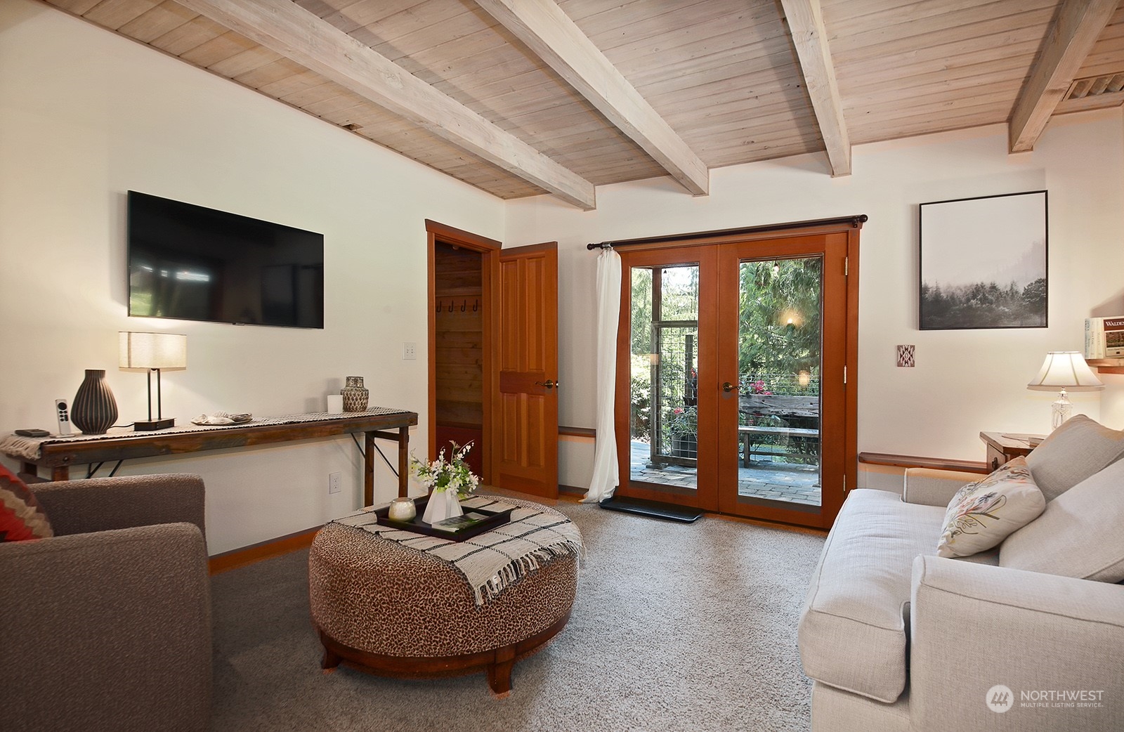 5120 Ribbit Road Langley, WA 98260 - Photo 27 of 40 a living room with furniture and a flat screen tv