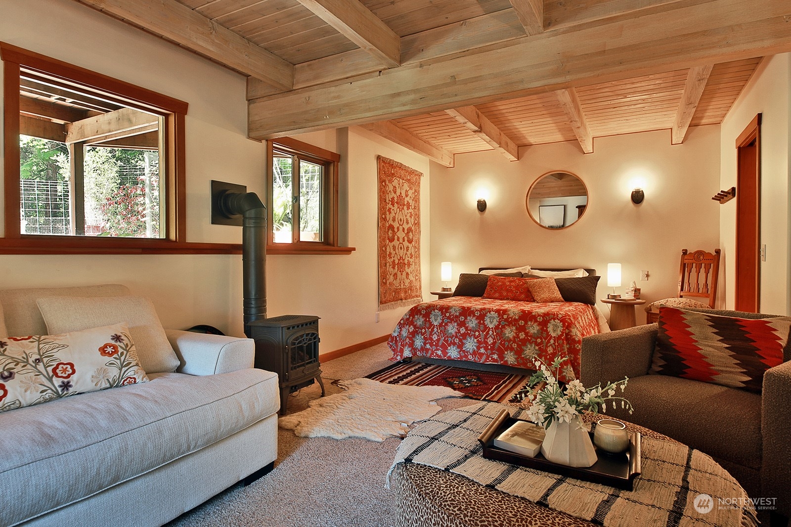 5120 Ribbit Road Langley, WA 98260 - Photo 28 of 40 a bedroom with a bed and wooden floor