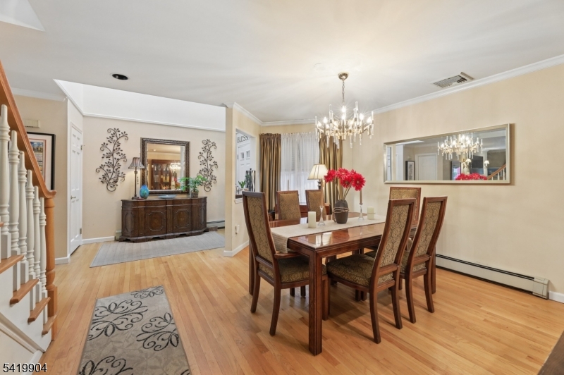 7 Valen Court Franklin Lakes, NJ 07417 - Photo 12 of 32 a view of a dining room with furniture and chandelier