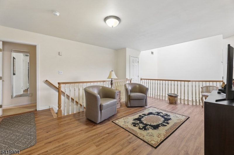 7 Valen Court Franklin Lakes, NJ 07417 - Photo 14 of 32 a living room with furniture rug and wooden floor