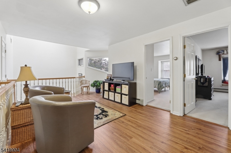 7 Valen Court Franklin Lakes, NJ 07417 - Photo 15 of 32 a living room with furniture and a wooden floor